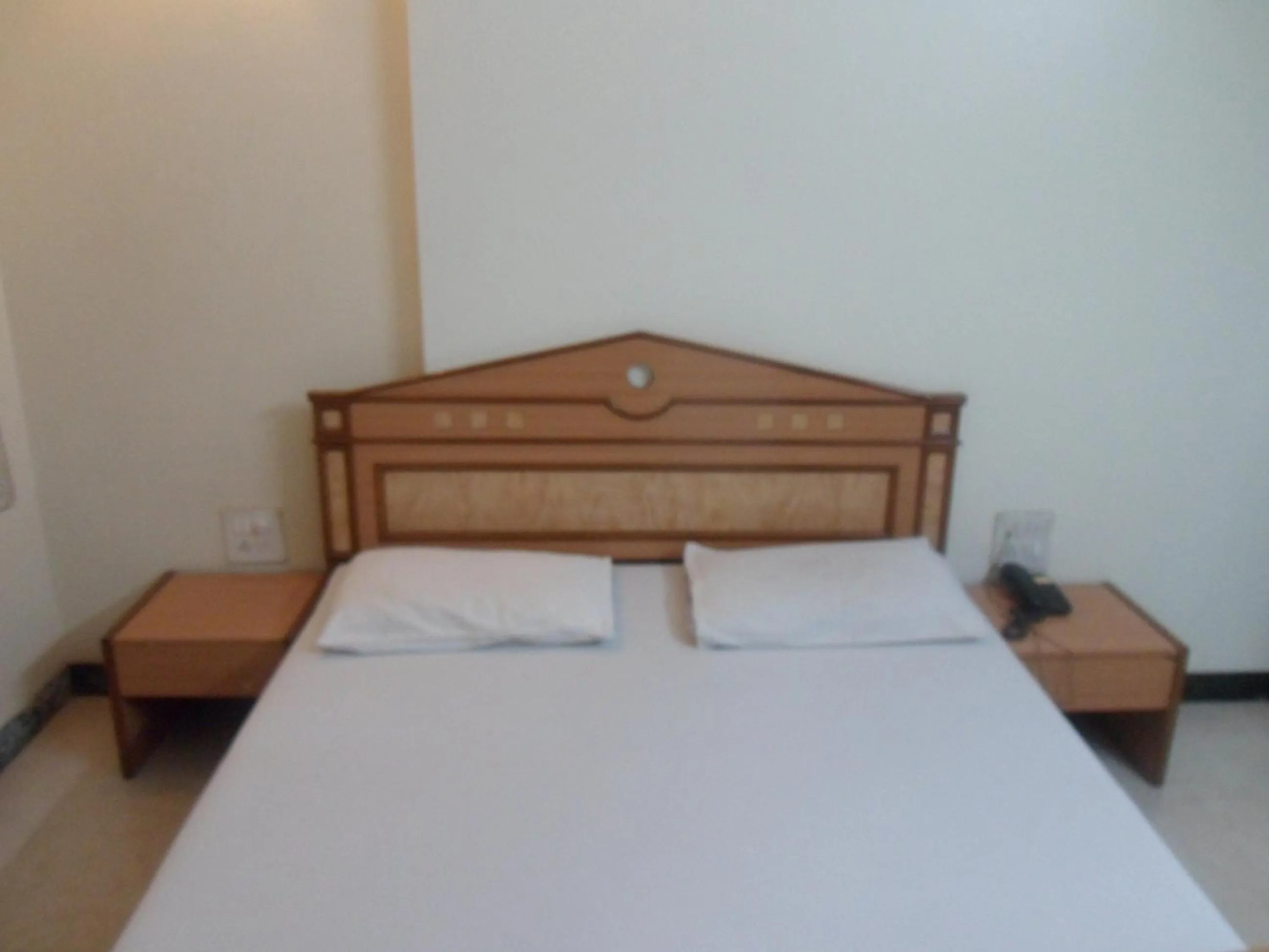 Bed in Hotel Pooja International