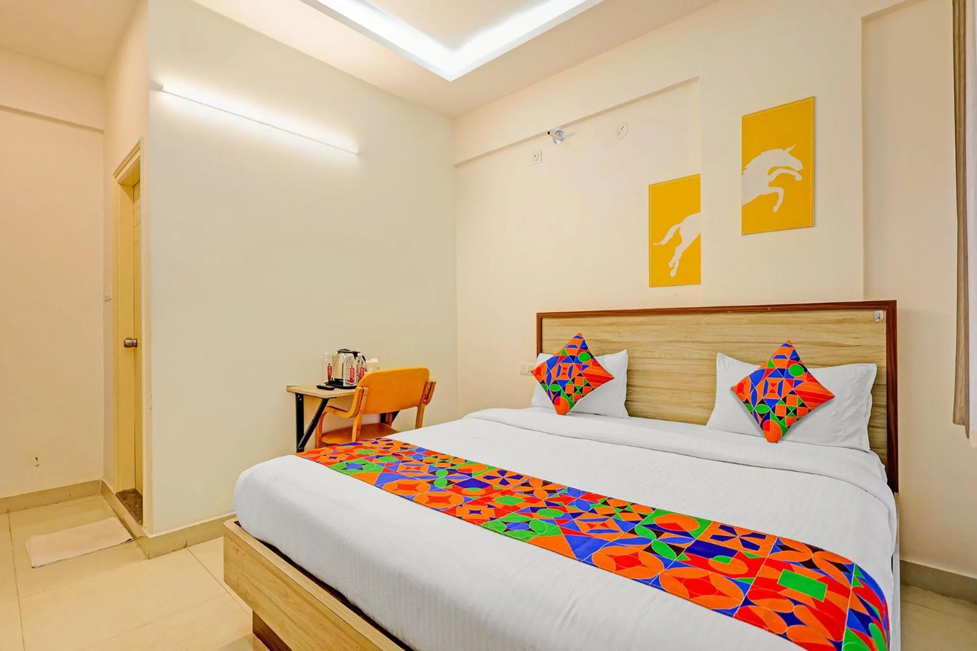 Bed in FabHotel Marella Grand Inn