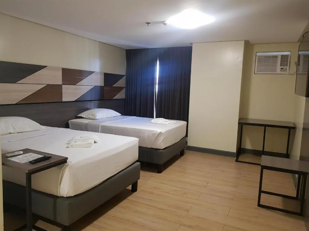 Bed in Travelite Hotel Legarda