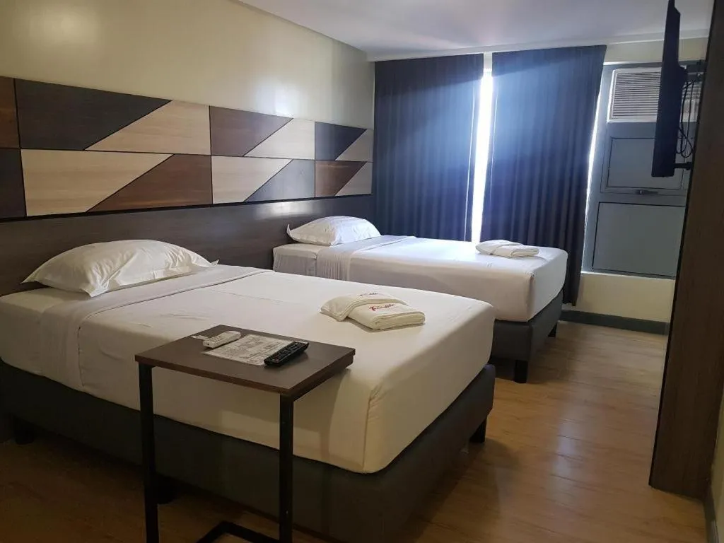 Bed in Travelite Hotel Legarda
