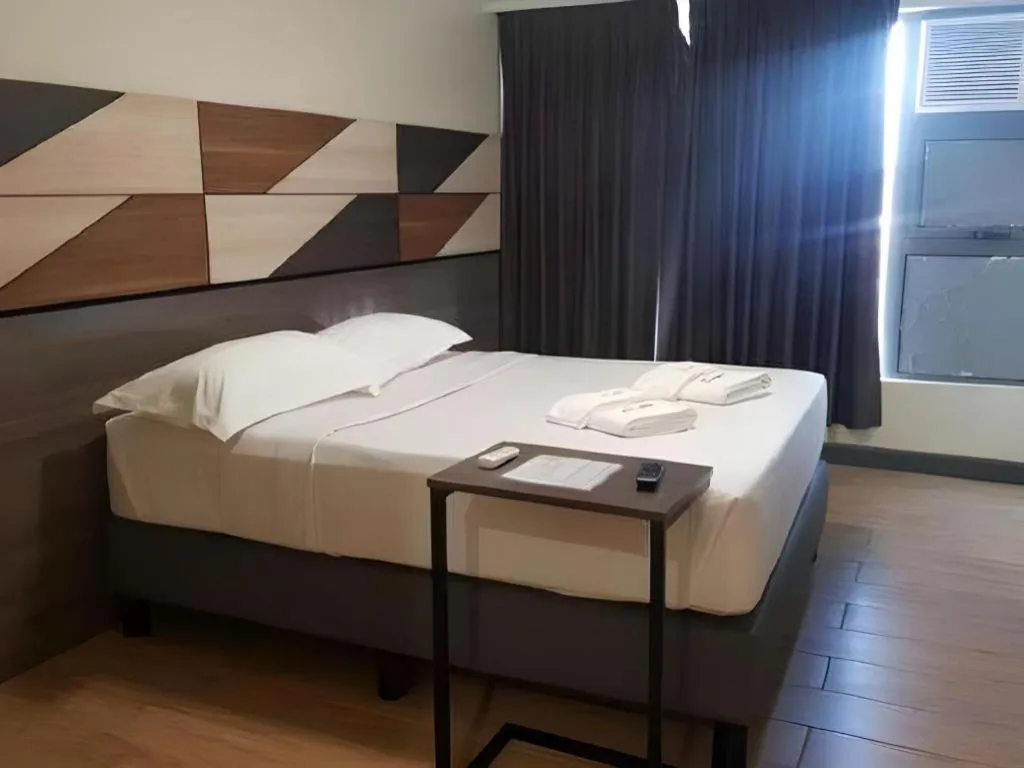 Bed in Travelite Hotel Legarda