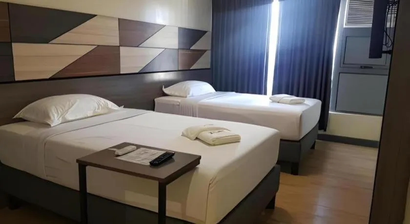 Bed in Travelite Hotel Legarda
