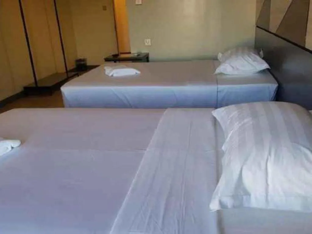 Bed in Travelite Hotel Legarda