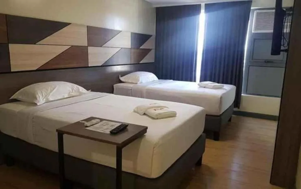 Bed in Travelite Hotel Legarda