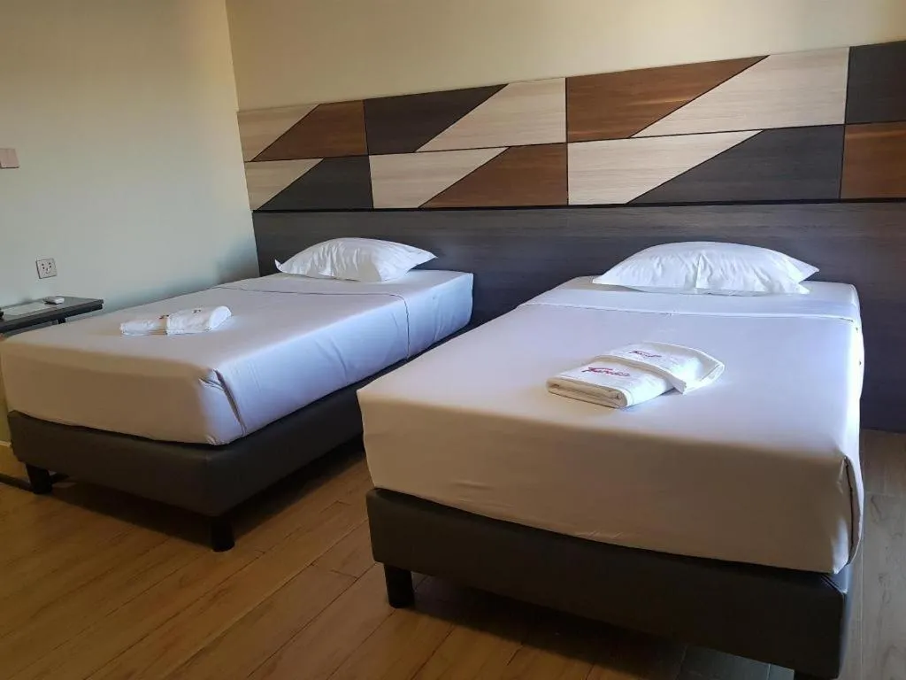 Bed in Travelite Hotel Legarda