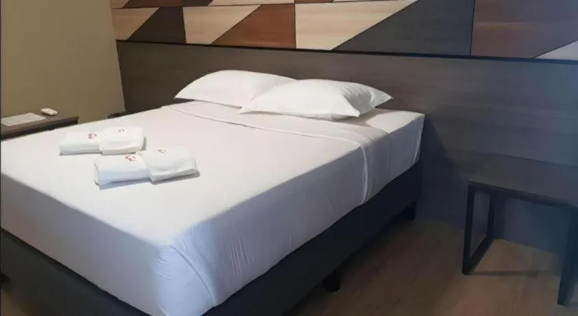 Bed in Travelite Hotel Legarda