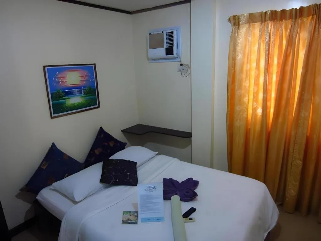 Bed in La Bella Casa Boracay Hotel