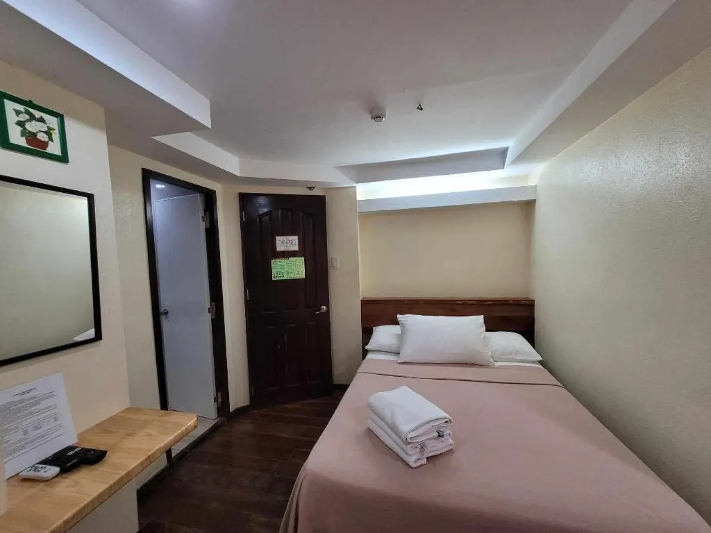 Bed in La Bella Casa Boracay Hotel