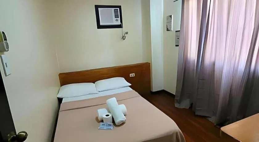 Bed in La Bella Casa Boracay Hotel