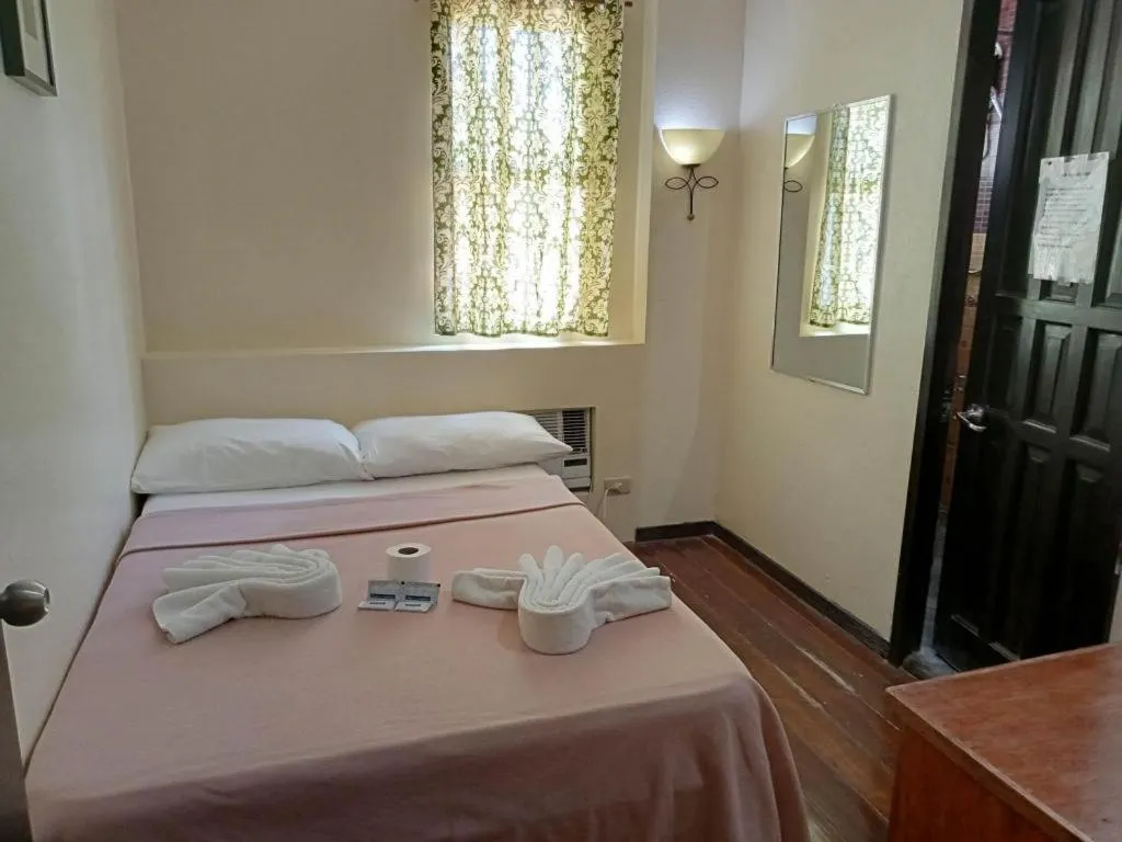 Bed in La Bella Casa Boracay Hotel