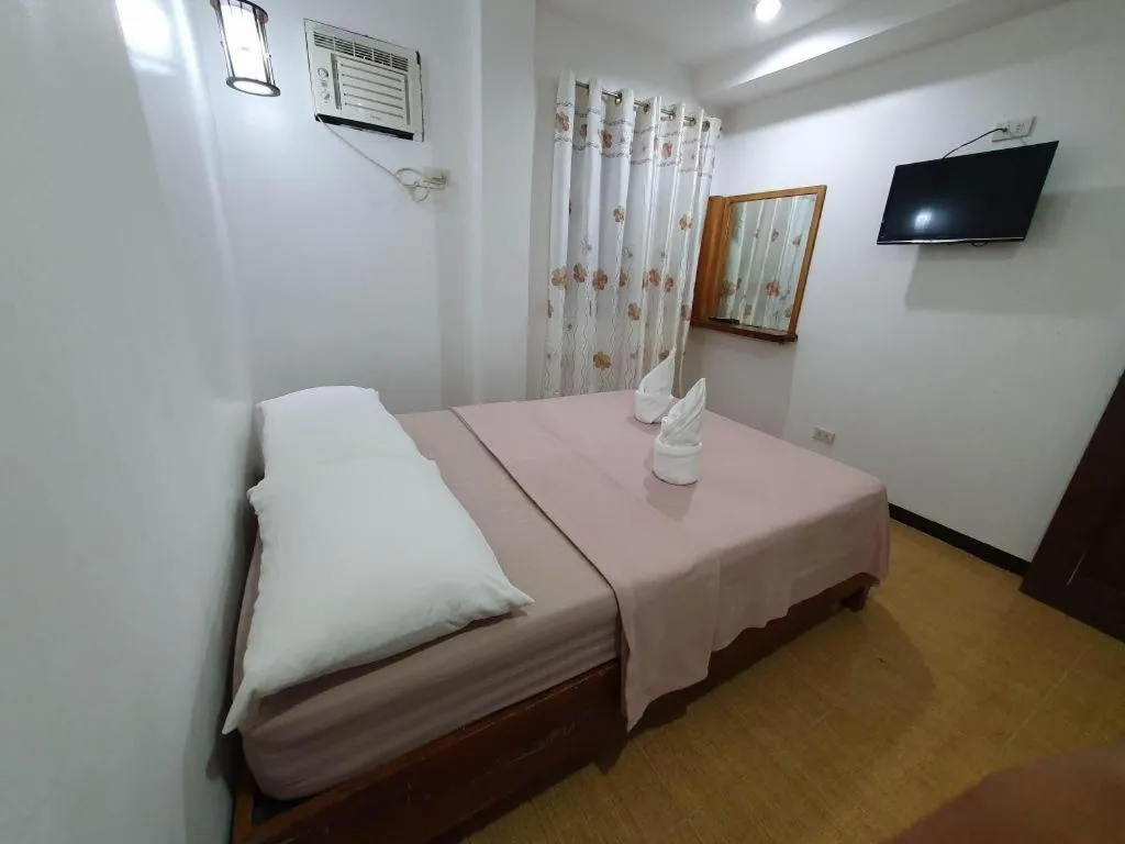 Bed in La Bella Casa Boracay Hotel