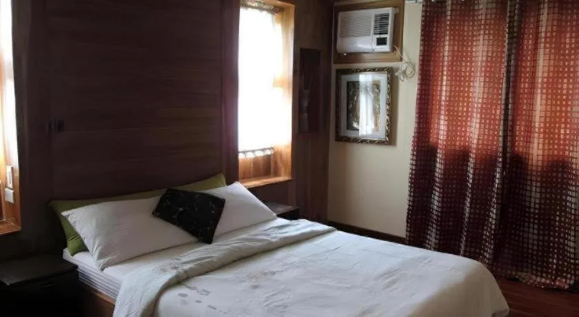 Bed in La Bella Casa Boracay Hotel