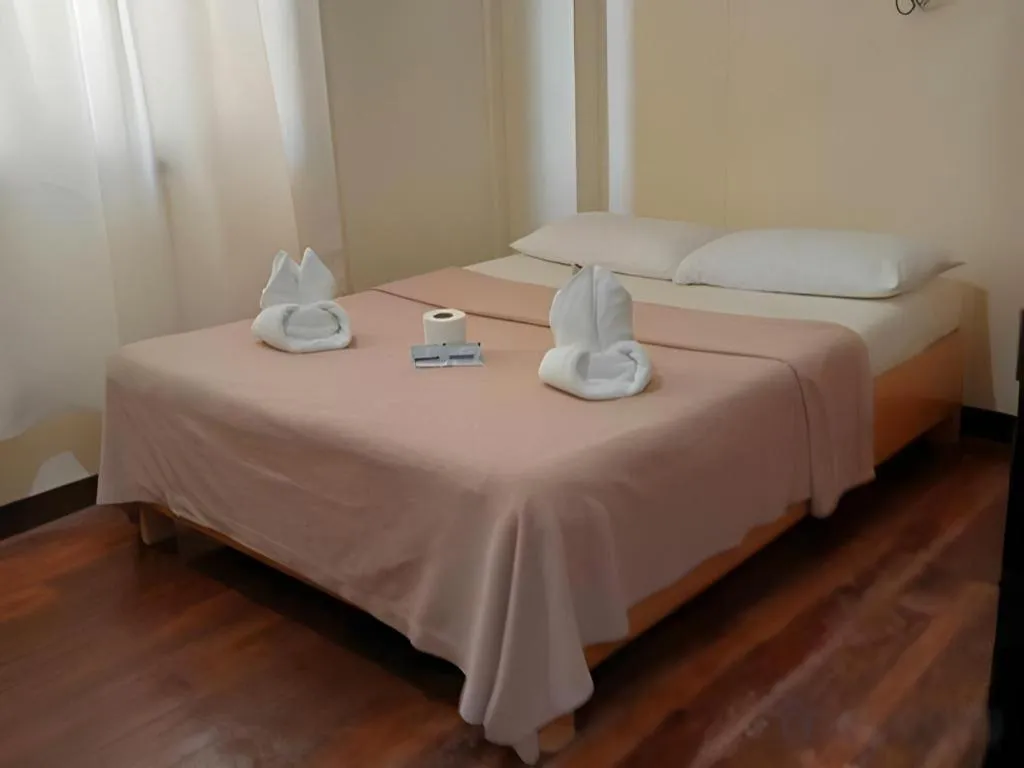 Bed in La Bella Casa Boracay Hotel