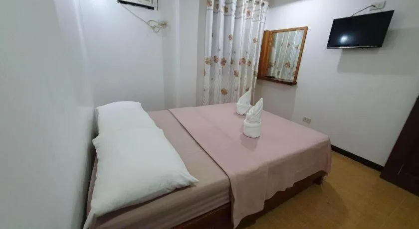 Bed in La Bella Casa Boracay Hotel