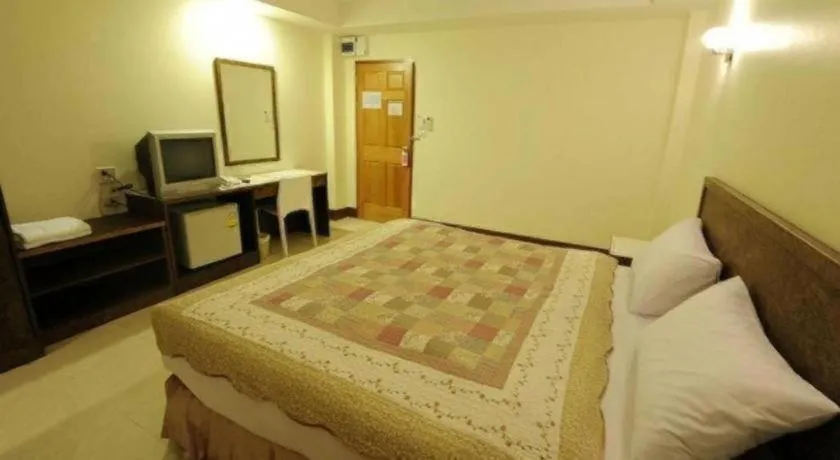 Bed in Trat Center Hotel