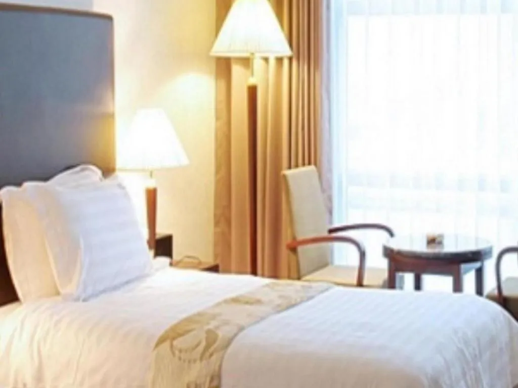 Bed in Hotel Sunshine