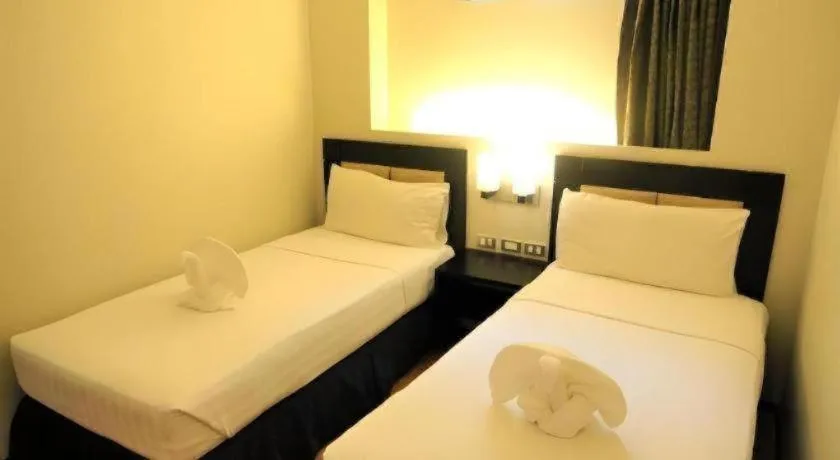 Bed in Mallberry Suites Business Hotel