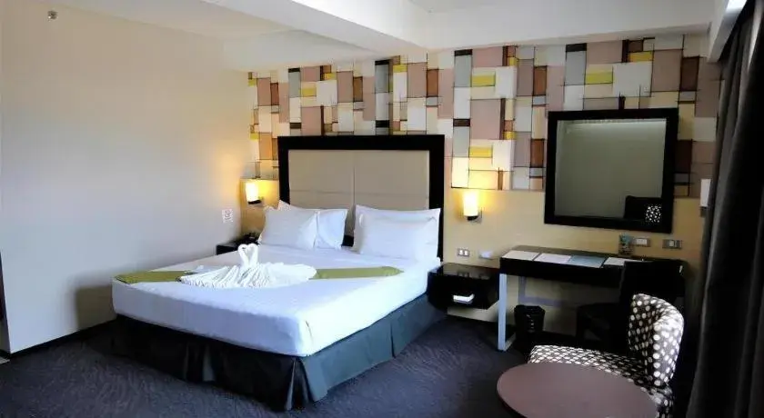 Bed in Mallberry Suites Business Hotel Bed in Mallberry Suites Business Hotel