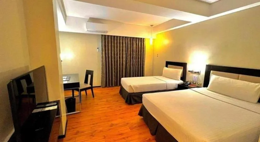 Bed in Mallberry Suites Business Hotel