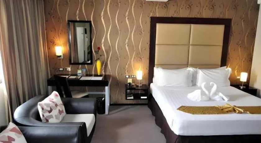 Bed in Mallberry Suites Business Hotel
