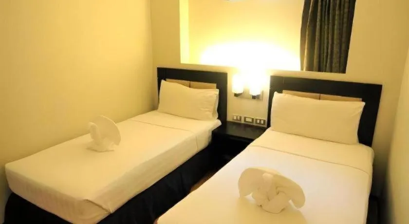 Bed in Mallberry Suites Business Hotel