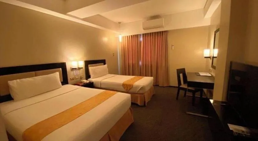 Bed in Mallberry Suites Business Hotel
