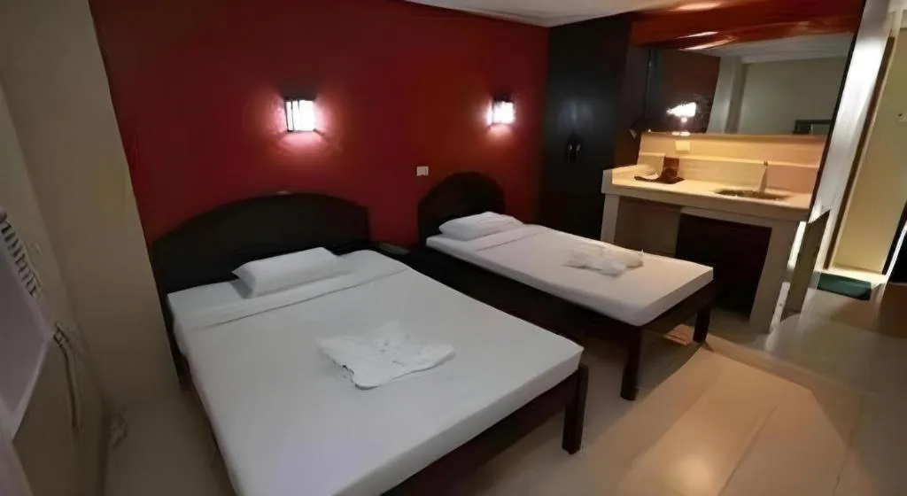 Bed in Sampaguita Suites Plaza Garcia