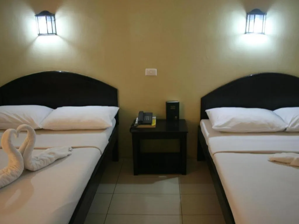 Bed in Sampaguita Suites Plaza Garcia