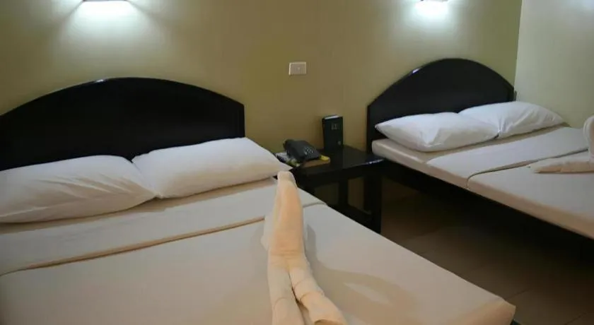 Bed in Sampaguita Suites Plaza Garcia