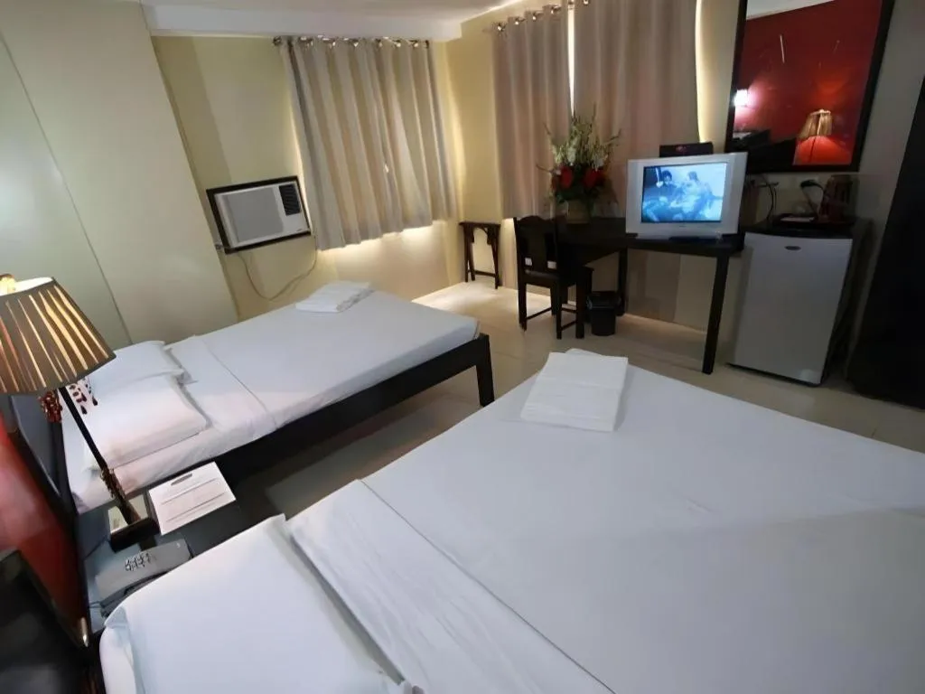 Bed in Sampaguita Suites Plaza Garcia