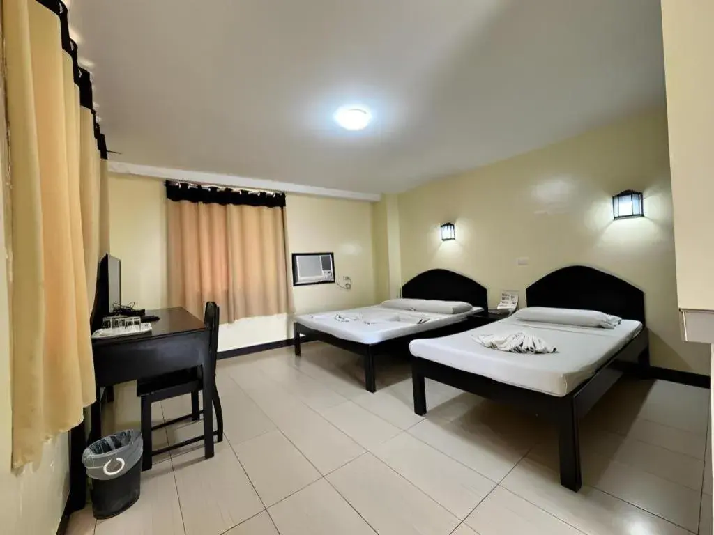 Bed in Sampaguita Suites Plaza Garcia Bed in Sampaguita Suites Plaza Garcia