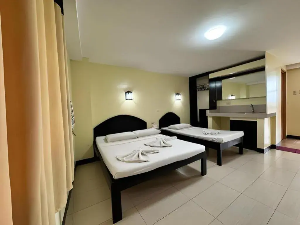 Bed in Sampaguita Suites Plaza Garcia Bed in Sampaguita Suites Plaza Garcia