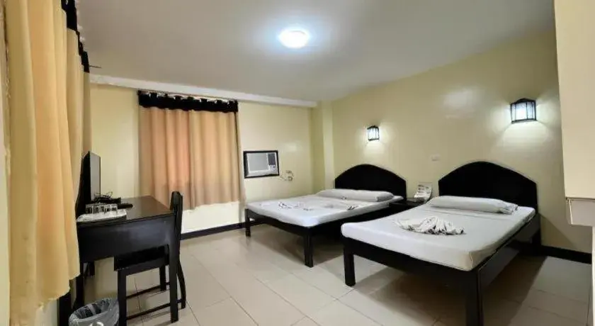 Bed in Sampaguita Suites Plaza Garcia Bed in Sampaguita Suites Plaza Garcia
