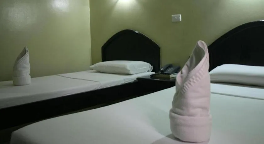 Bed in Sampaguita Suites Plaza Garcia