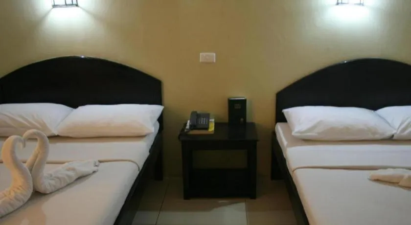 Bed in Sampaguita Suites Plaza Garcia