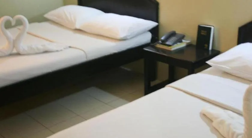 Bed in Sampaguita Suites Plaza Garcia