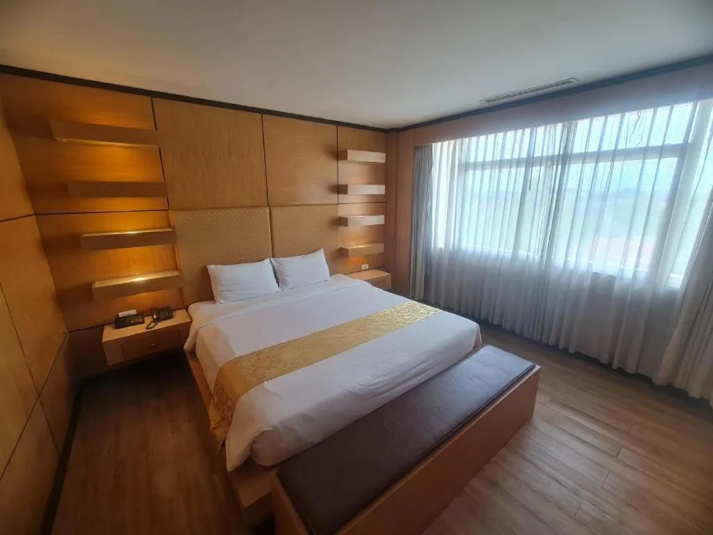 Bed in Western Grand Hotel Ratchaburi