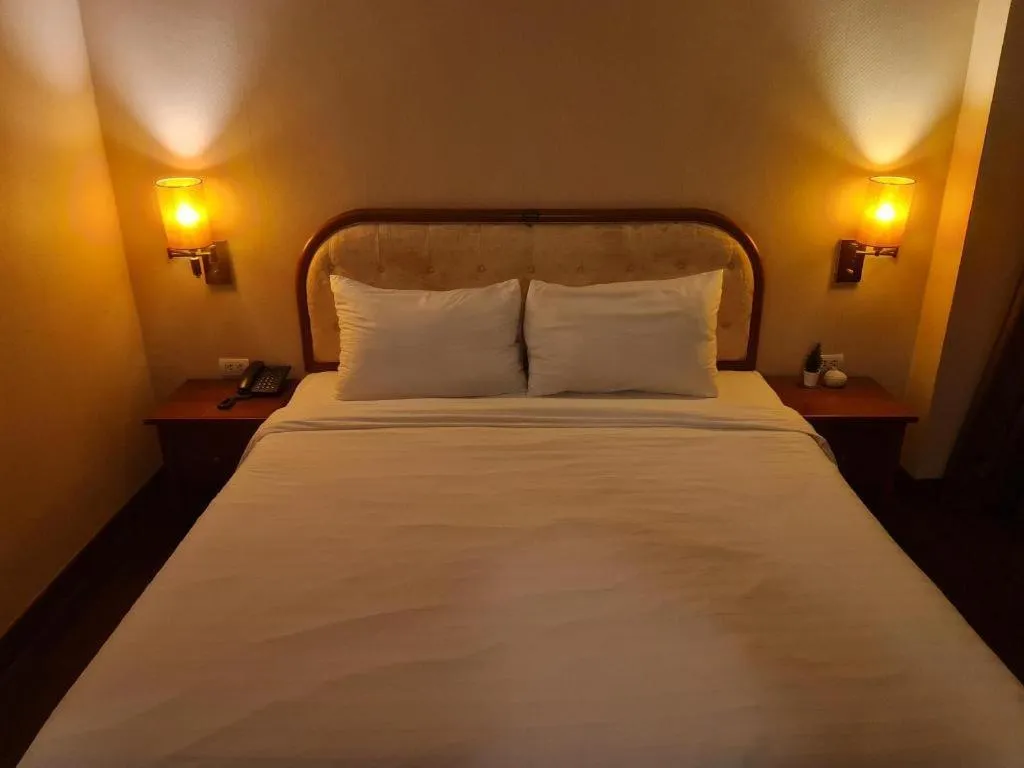 Bed in Western Grand Hotel Ratchaburi