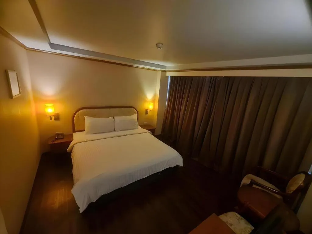 Bed in Western Grand Hotel Ratchaburi