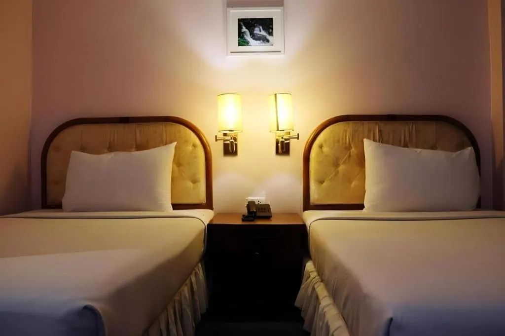 Bed in Western Grand Hotel Ratchaburi