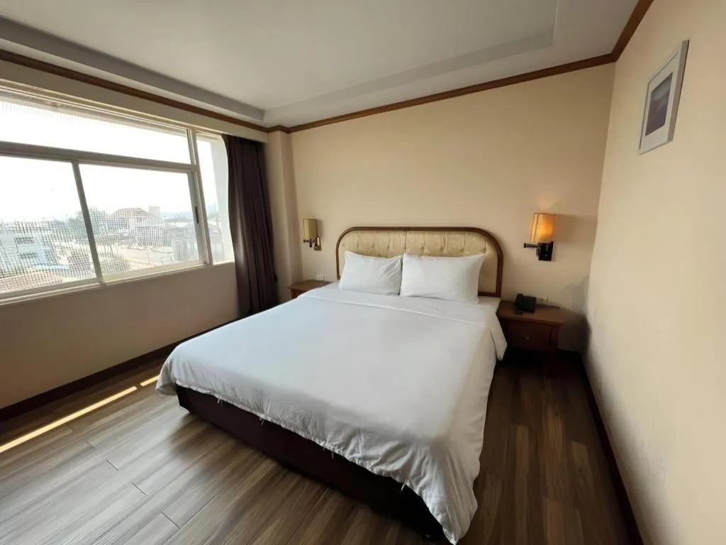 Bed in Western Grand Hotel Ratchaburi