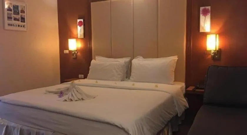 Bed in Western Grand Hotel Ratchaburi