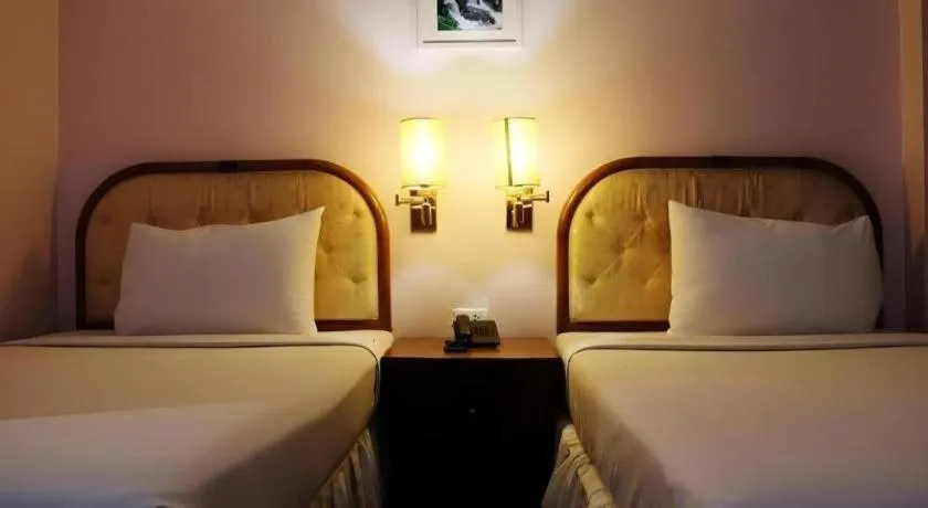 Bed in Western Grand Hotel Ratchaburi