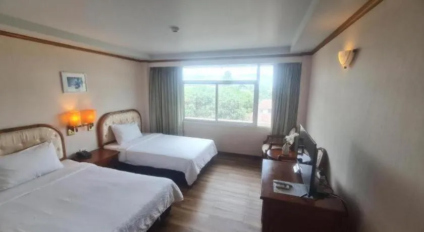 Bed in Western Grand Hotel Ratchaburi