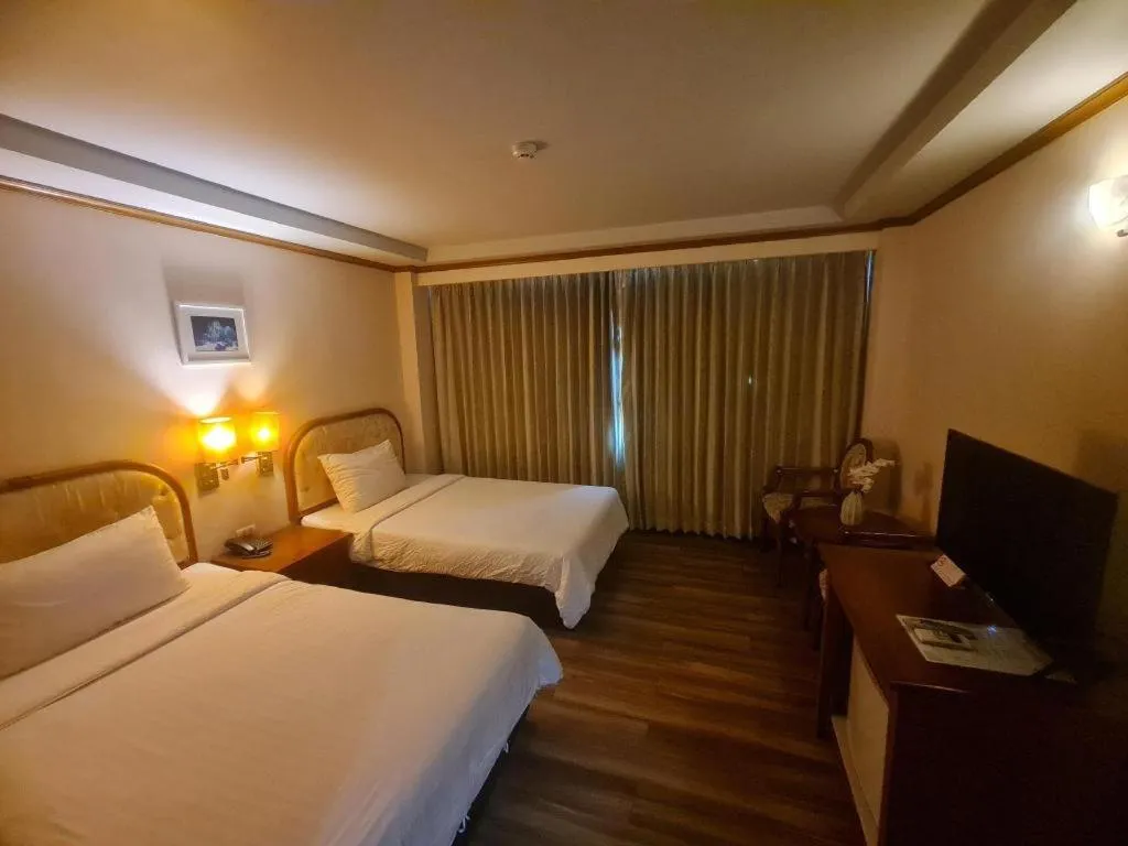 Bed in Western Grand Hotel Ratchaburi