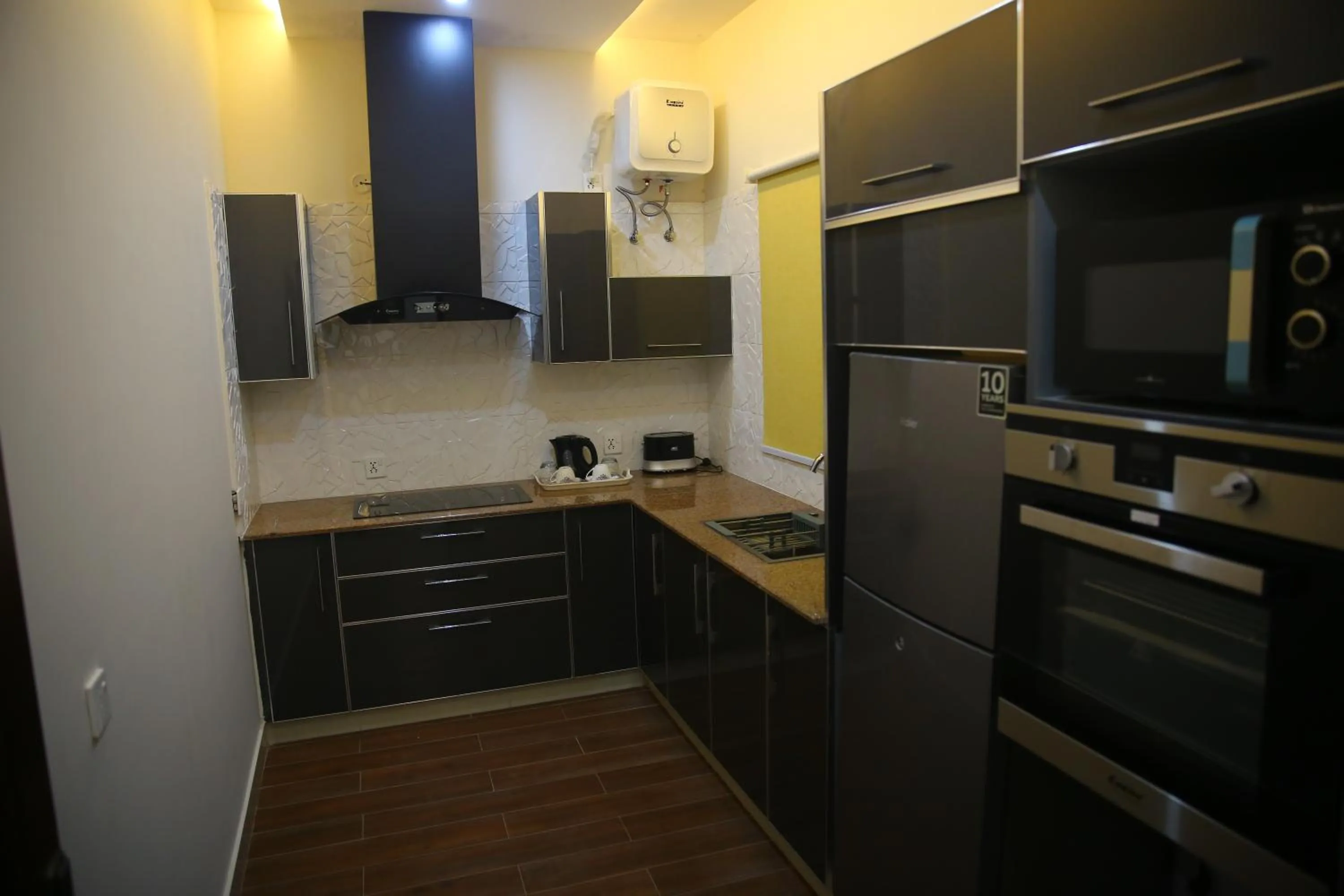 Kitchen or kitchenette in Gulberg Suites