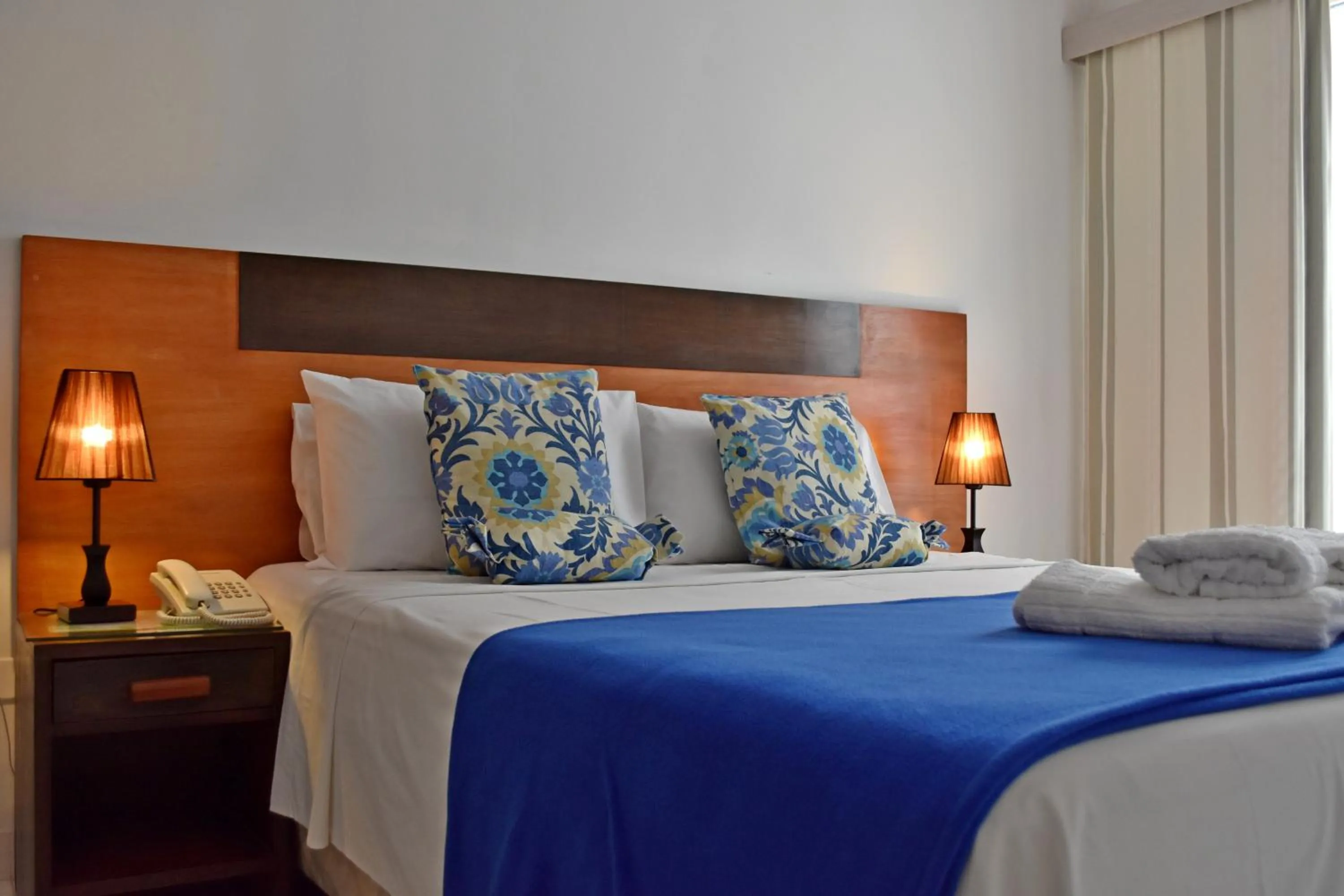 Bed in Giuseppe Suites Hotel