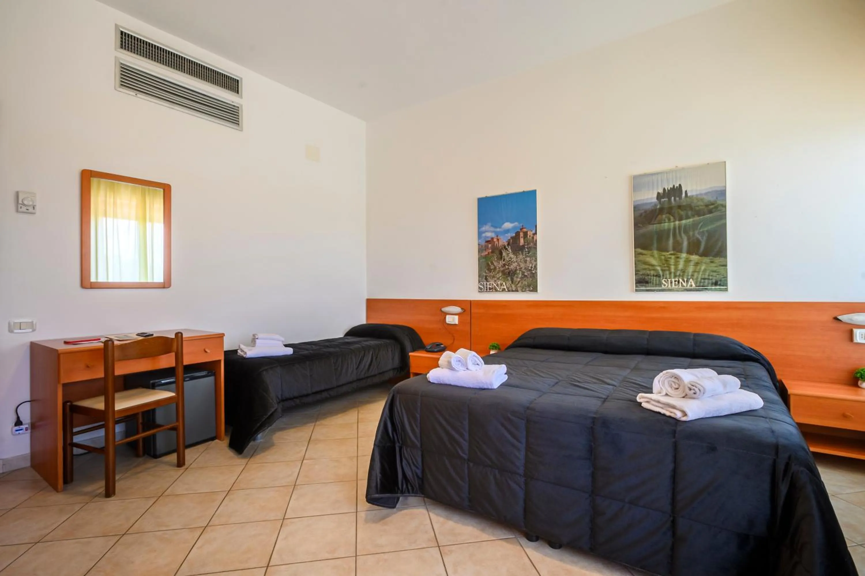 Decorative detail, Bed in Hotel Vico Alto Siena