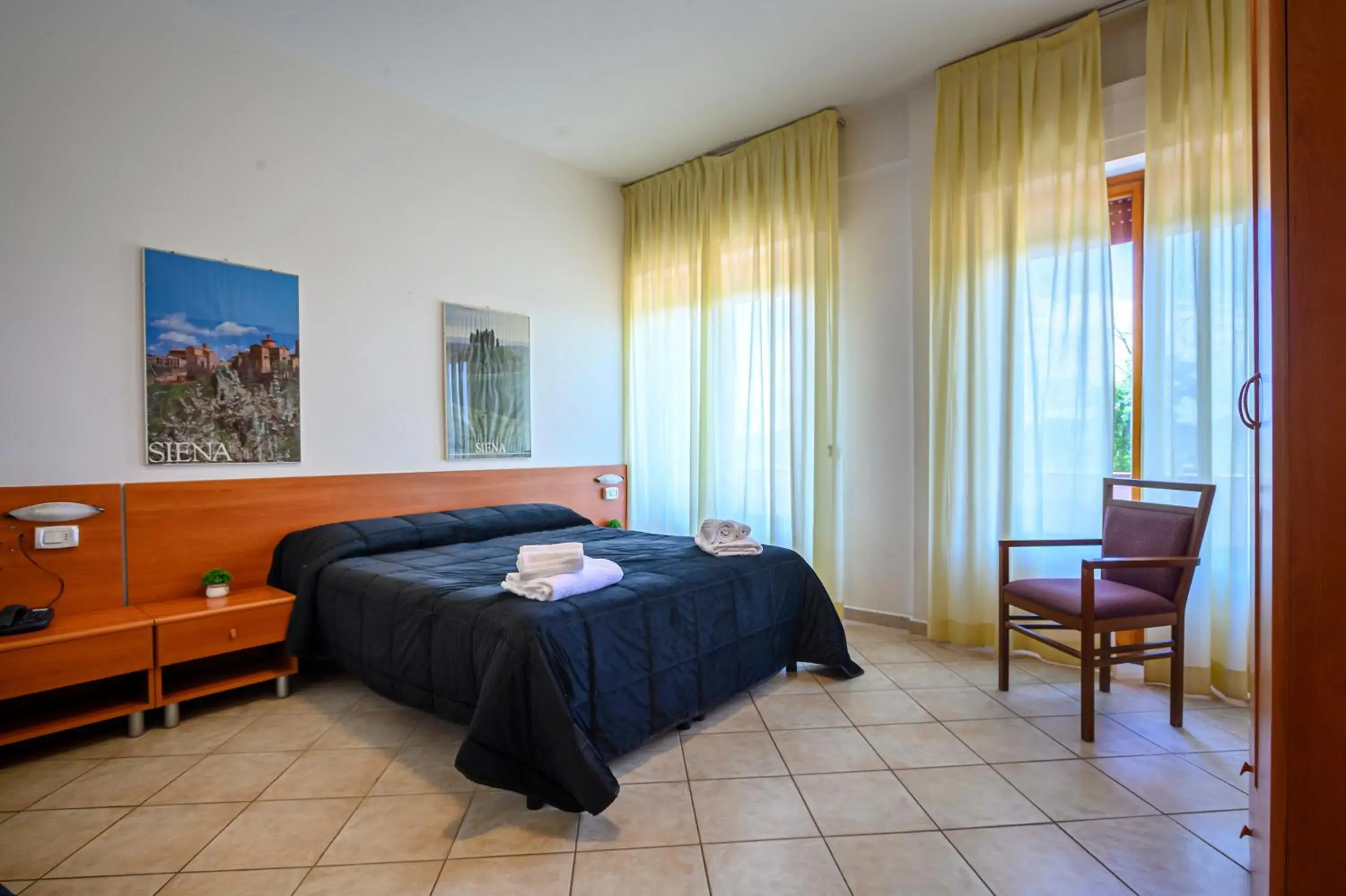 Bedroom, Bed in Hotel Vico Alto Siena Bedroom, Bed in Hotel Vico Alto Siena