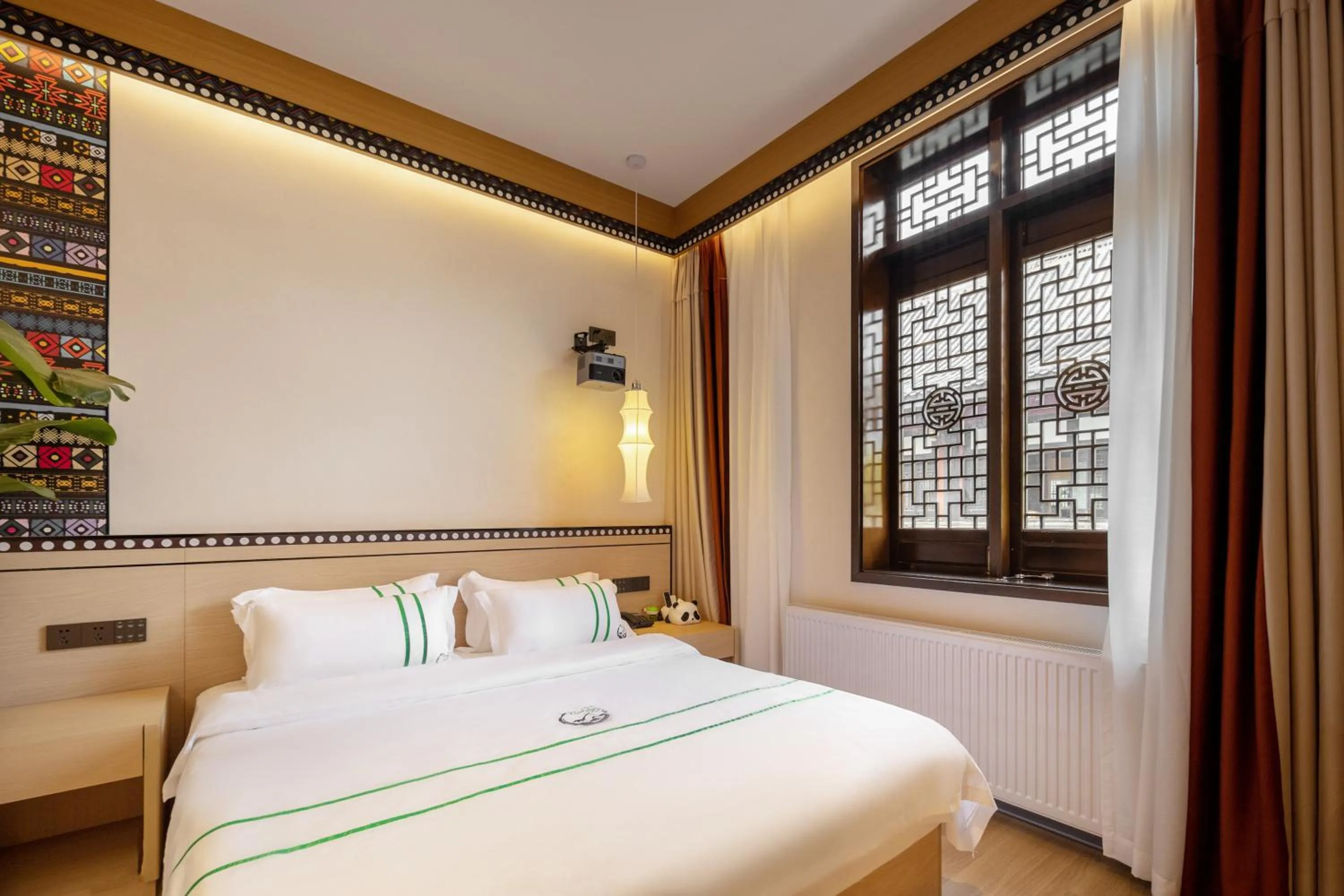 Bedroom, Bed in Xishu Garden Inn - Travel Agency service - Car Rent service - English Speaking